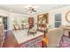 Inviting living room featuring hardwood floors, a ceiling fan, and access to outdoor spaces at 8033 Pawleys Ct, Fort Mill, SC 29707