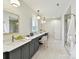 Spacious bathroom featuring dual vanities, decorative mirrors and a luxurious walk-in shower at 8108 Farm Crossing Ln # 26, Huntersville, NC 28078