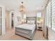 Cozy bedroom with a stylish bed, soft lighting, and charming decor at 8108 Farm Crossing Ln # 26, Huntersville, NC 28078