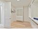 Well-organized walk-in closet with custom shelving, drawers, and ample storage space at 8108 Farm Crossing Ln # 26, Huntersville, NC 28078