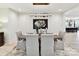Bright dining room featuring light hardwood floors, elegant lighting, modern decor, and comfortable seating at 8108 Farm Crossing Ln # 26, Huntersville, NC 28078