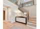 Welcoming entryway with elegant staircase, decorative console table, and stylish lighting at 8108 Farm Crossing Ln # 26, Huntersville, NC 28078