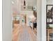 Light-filled foyer featuring hardwood floors, modern chandelier, and staircase with decorative iron railing at 8108 Farm Crossing Ln # 26, Huntersville, NC 28078