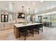 Open-concept kitchen with a large island and pendant lighting is adjacent to the dining area at 8108 Farm Crossing Ln # 26, Huntersville, NC 28078