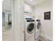 Functional laundry room with modern appliances and stylish tile flooring at 8108 Farm Crossing Ln # 26, Huntersville, NC 28078