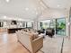 Expansive open-concept living room with hardwood floors and a seamless connection to the kitchen at 8108 Farm Crossing Ln # 26, Huntersville, NC 28078