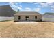Spacious backyard with a patio, perfect for outdoor entertaining and relaxation at 8316 Highgate Dr, Charlotte, NC 28215