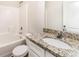 A clean and well-maintained bathroom featuring granite counters at 8316 Highgate Dr, Charlotte, NC 28215