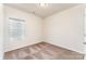 A well-lit bedroom features plush carpeting and a bright window at 8316 Highgate Dr, Charlotte, NC 28215