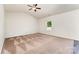 Spacious bedroom featuring carpet flooring, a ceiling fan, and a bright window view at 8316 Highgate Dr, Charlotte, NC 28215