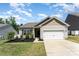 Charming single-story home featuring a well-manicured lawn, a two car garage, and pleasant curb appeal at 8316 Highgate Dr, Charlotte, NC 28215