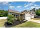 Charming single-story home with manicured lawn, features a two car garage and beautiful landscaping at 8316 Highgate Dr, Charlotte, NC 28215