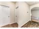 Inviting hallway featuring carpet and wood flooring, creating a warm and welcoming entrance at 8316 Highgate Dr, Charlotte, NC 28215