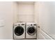 A functional laundry room equipped with modern washer and dryer units at 8316 Highgate Dr, Charlotte, NC 28215