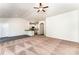 Bright living room featuring carpet flooring and open access to the kitchen with white cabinets at 8316 Highgate Dr, Charlotte, NC 28215