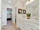 Bright bathroom featuring double sinks, white cabinets, and a walk-in shower with glass doors at 833 Hallman Branch Ln, Lincolnton, NC 28092