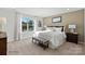 Spacious bedroom with large windows offering natural light, a king-size bed, and stylish decor at 833 Hallman Branch Ln, Lincolnton, NC 28092