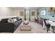 Comfortable bedroom with a gray sofa, a desk, and a built-in shelf, perfect for relaxation at 833 Hallman Branch Ln, Lincolnton, NC 28092