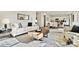Open-concept living room with modern furnishings and a view of the dining area and kitchen at 833 Hallman Branch Ln, Lincolnton, NC 28092