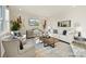Bright, modern living room featuring neutral tones, stylish decor, and ample natural light at 833 Hallman Branch Ln, Lincolnton, NC 28092