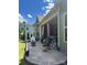 Charming covered patio with paver flooring, outdoor seating, and views of the landscaped backyard at 10039 St Kitts Landing Ln, Charlotte, NC 28278