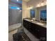Ensuite bathroom with double sink vanity and walk-in shower at 10039 St Kitts Landing Ln, Charlotte, NC 28278