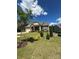 Charming home with stone accents, a two-car garage, and a well-manicured lawn on a sunny day at 10039 St Kitts Landing Ln, Charlotte, NC 28278