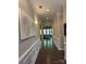 Inviting hallway with hardwood floors, decorative wall trim, and recessed lighting leading to the living area at 10039 St Kitts Landing Ln, Charlotte, NC 28278
