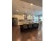 Gourmet kitchen with stainless steel appliances, granite counters, and a center island at 10039 St Kitts Landing Ln, Charlotte, NC 28278