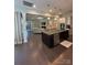 Open kitchen and living area featuring modern appliances and granite countertops at 10039 St Kitts Landing Ln, Charlotte, NC 28278