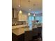 Modern kitchen island features granite countertops, pendant lighting, stainless steel appliances, and a view of the breakfast nook at 10039 St Kitts Landing Ln, Charlotte, NC 28278
