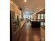 Open-concept kitchen with stainless steel appliances, a granite island, and a view of the adjacent breakfast area at 10039 St Kitts Landing Ln, Charlotte, NC 28278
