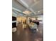 Spacious living area with coffered ceiling, fireplace, and seamless transition to the kitchen, creating a bright and inviting atmosphere at 10039 St Kitts Landing Ln, Charlotte, NC 28278