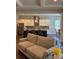 Comfortable living room flowing into a modern kitchen with stainless steel appliances, granite countertops, and an island with bar seating at 10039 St Kitts Landing Ln, Charlotte, NC 28278