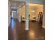 Spacious living area with hardwood floors, decorative trim, and an open layout at 10039 St Kitts Landing Ln, Charlotte, NC 28278