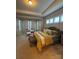 Spacious main bedroom with tray ceiling, sitting area, and natural light at 10039 St Kitts Landing Ln, Charlotte, NC 28278