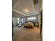 Spacious main bedroom with tray ceiling, sitting area, and ensuite bathroom at 10039 St Kitts Landing Ln, Charlotte, NC 28278