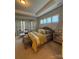 Spacious main bedroom with tray ceiling, sitting area, and natural light at 10039 St Kitts Landing Ln, Charlotte, NC 28278