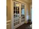 Bright office space with glass paneled french doors, carpet and neutral walls at 10039 St Kitts Landing Ln, Charlotte, NC 28278