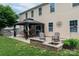 Backyard patio featuring an outdoor kitchen, gazebo, fire pit, and space for entertaining at 109 Meadow Stream Dr, Mount Holly, NC 28120