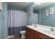 Cozy bathroom with a double vanity, toilet, and shower with curtain, offering a functional space at 109 Meadow Stream Dr, Mount Holly, NC 28120