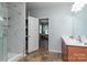 Well-appointed bathroom with a glass-enclosed shower and double sink vanity at 109 Meadow Stream Dr, Mount Holly, NC 28120