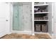 Modern bathroom features a glass-enclosed shower and built-in shelving at 109 Meadow Stream Dr, Mount Holly, NC 28120