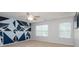 Bedroom featuring a modern geometric accent wall, plush carpet and window with natural light at 109 Meadow Stream Dr, Mount Holly, NC 28120