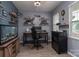 Bedroom featuring stylish gray walls, built in shelving, and modern furniture at 109 Meadow Stream Dr, Mount Holly, NC 28120