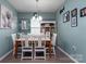 Dining room featuring natural light, seating for six, and stylish decor at 109 Meadow Stream Dr, Mount Holly, NC 28120
