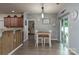 Dining area features wood-look flooring, modern lighting, and access to the outdoors at 109 Meadow Stream Dr, Mount Holly, NC 28120