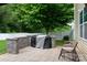 Built-in outdoor kitchen with a grill and prep area, perfect for backyard barbecues and entertaining at 109 Meadow Stream Dr, Mount Holly, NC 28120