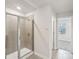 Bright bathroom featuring tiled shower with glass door at 110 Obadiah Ct, Mooresville, NC 28115