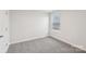 Cozy bedroom with carpet and a single window at 110 Obadiah Ct, Mooresville, NC 28115